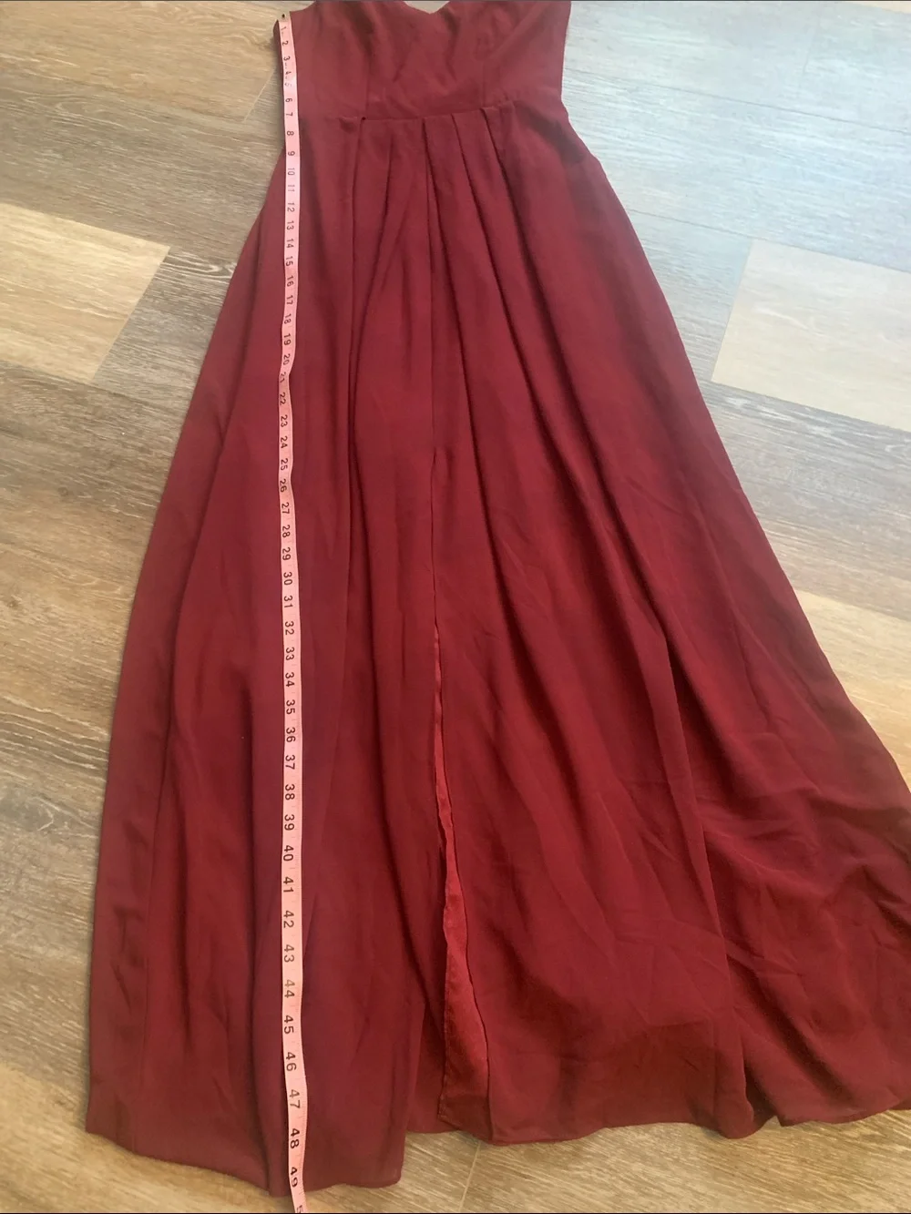 Adelyn Rae Burgundy Sleeveless V-Neck Maxi Dress with an opening between the leg